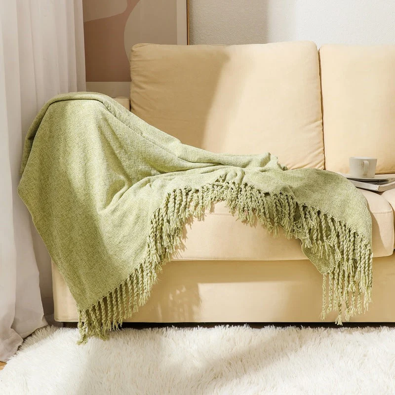 Kvinnelig elegant og stilfull sofa teppe med frynser Luvikno