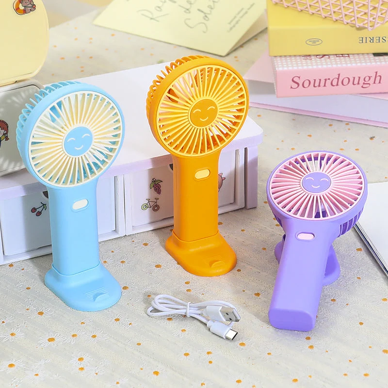 Dames bærbar USB håndvifte med innovativt smilendesign Luvikno