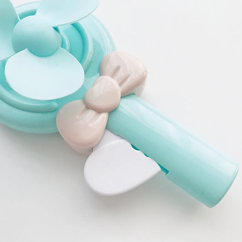 Bærbar håndholdt vifte for kvinner i lollipop-design Skanto