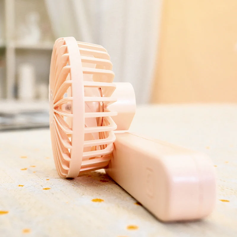 Kvinne bærbar håndholdt vifte med ergonomisk design og rask luftstrøm Luvikno