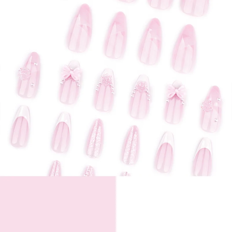 Artistic nail extensions with floral decorations and glitter accents Stornfield
