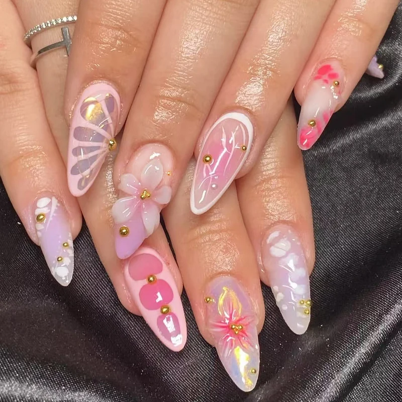 Artful Nail Extensions with Floral Patterns and Rhinestone Embellishments Stornfield