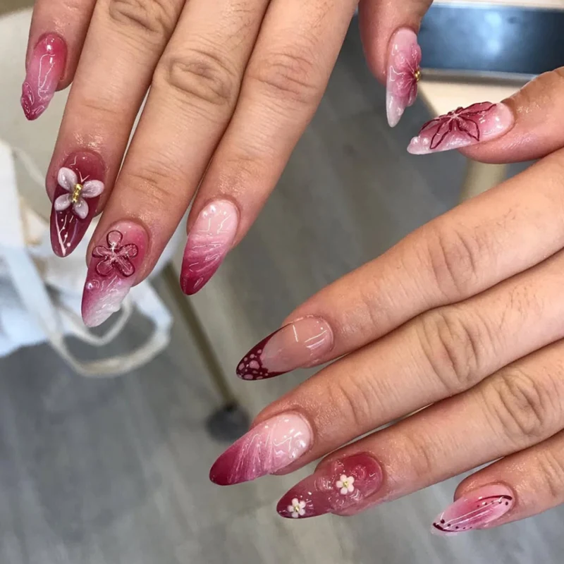 Artful nail extensions with floral details and ombre effect Stornfield