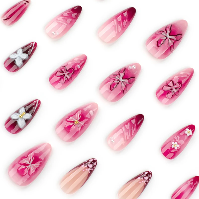 Artful nail extensions with floral details and ombre effect Stornfield