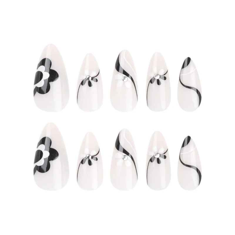 Artistic nail extensions with floral accents and glitter accents Stornfield
