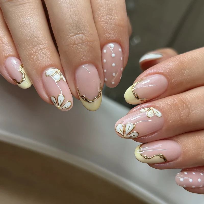 Artful Nail Extensions with Floral Design and Elegant Gold Accents Stornfield