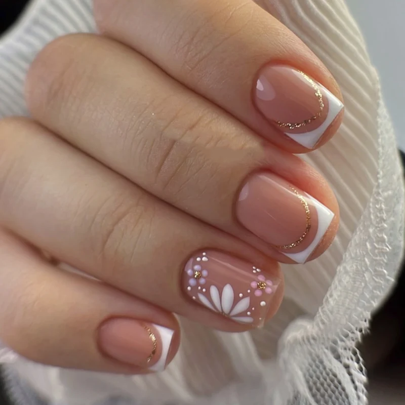 Artistic nail extensions with floral design and elegant accents Stornfield