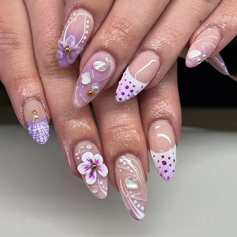 Artful nail extensions with elegant floral embellishments Stornfield