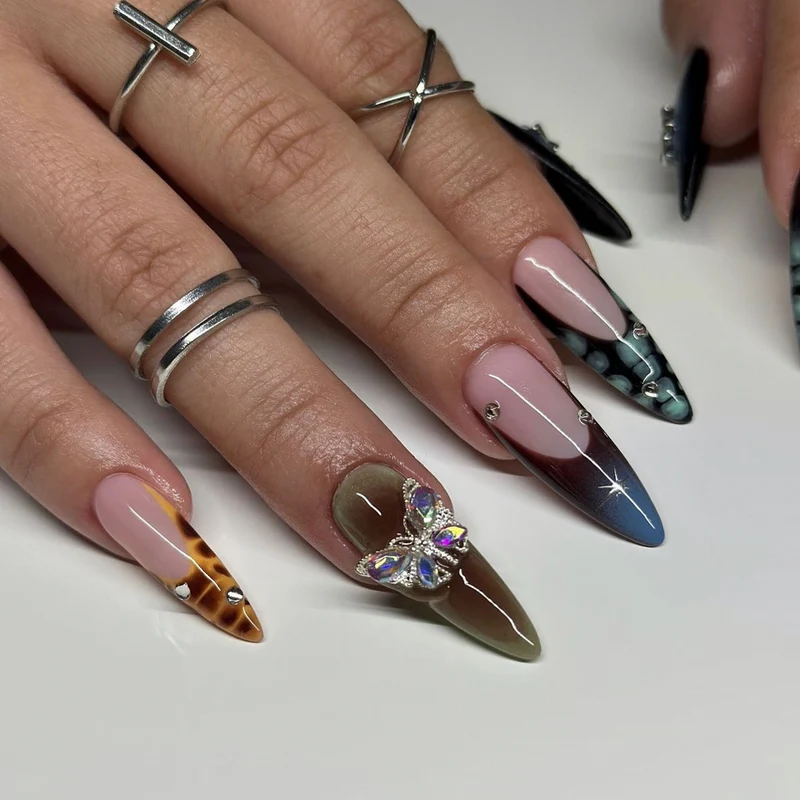 Artful nail extensions with elegant designs and glitter Stornfield