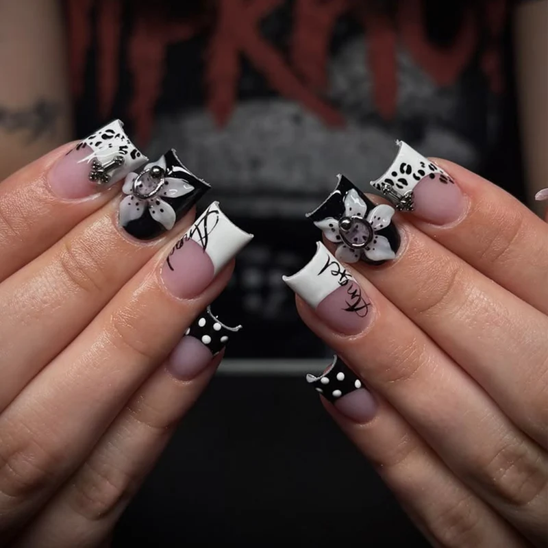 Artful nail extensions with elegant black-and-white design Stornfield