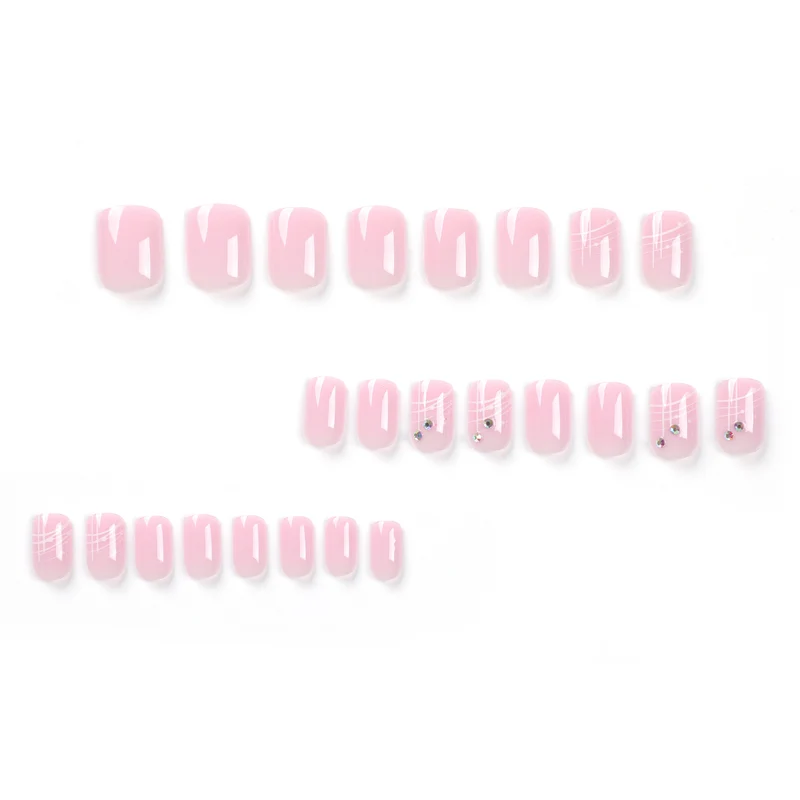 Artful nail extensions with elegant design and rhinestone embellishments Stornfield