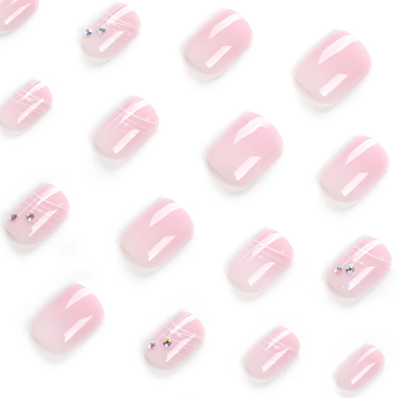 Artful nail extensions with elegant design and rhinestone embellishments Stornfield