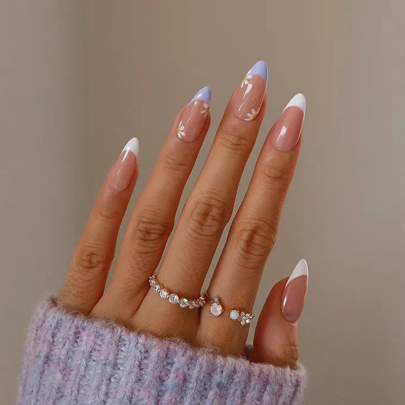 Artful nail extensions with an elegant leaf pattern Stornfield