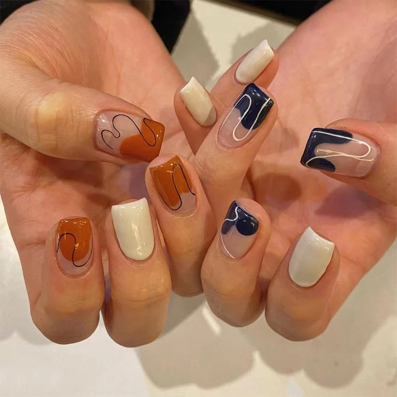Artful nail extensions with an elegant leaf pattern Stornfield