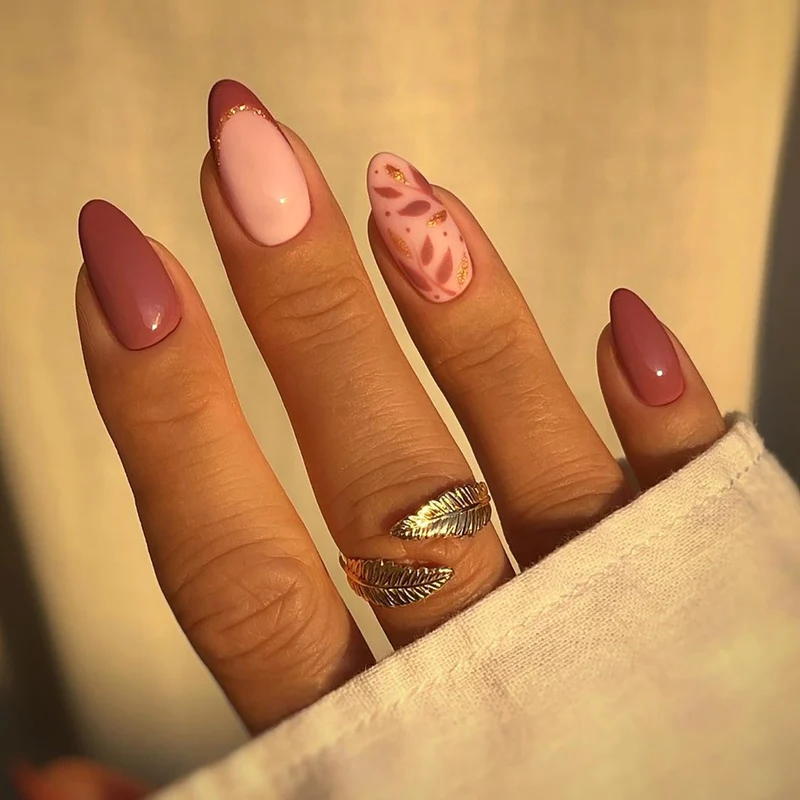 Artful nail extensions with an elegant leaf pattern Stornfield