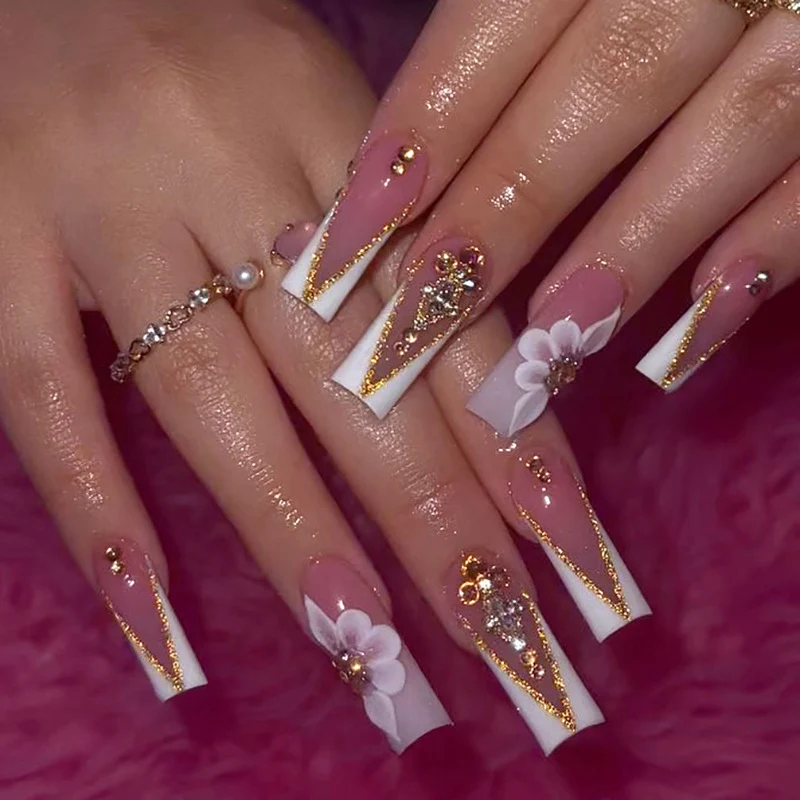 Artistic nail extensions with floral and glitter accents Stornfield