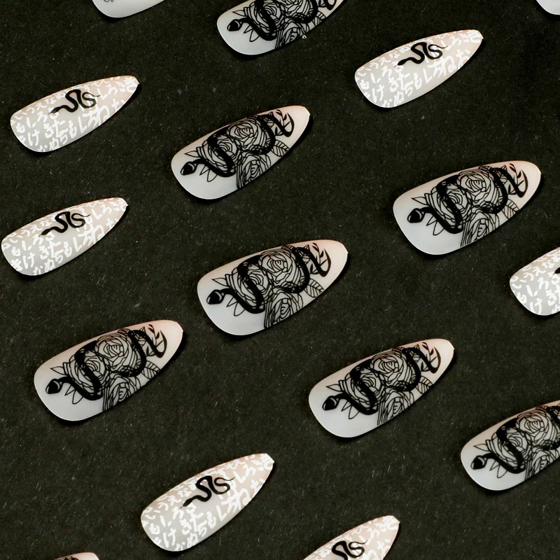 Artful nail extensions in elegant stiletto style with artistic floral and graphic designs Stornfield