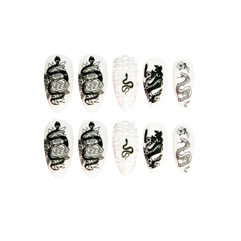 Artful nail extensions in elegant stiletto style with artistic floral and graphic designs Stornfield
