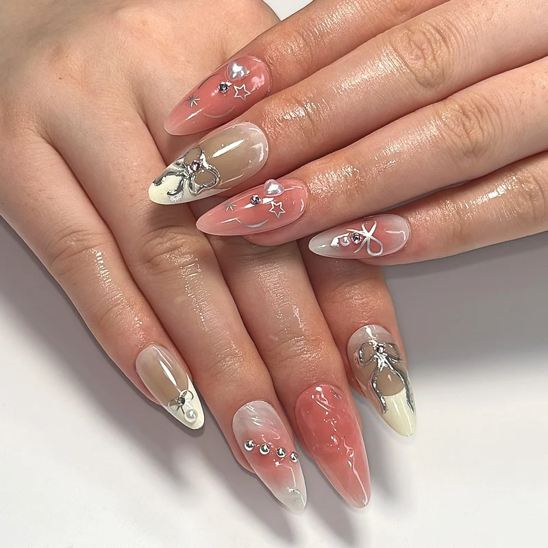 Artistic Nail Tips with Glitter and Bow Motifs Stornfield