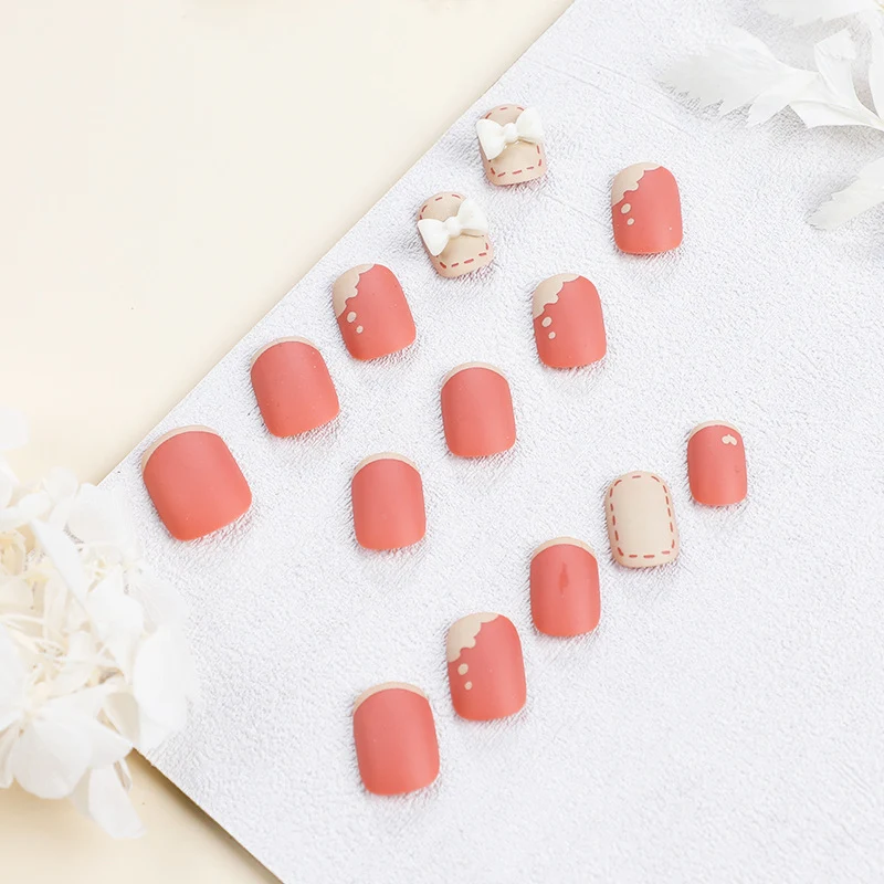 Artistic nail nails with decorative bow designs and French tips Stornfield