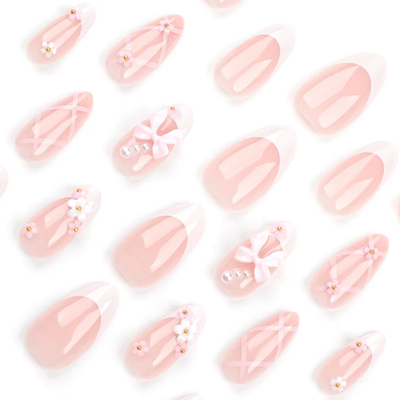 Artful nail art with delicate bows and floral accents Stornfield