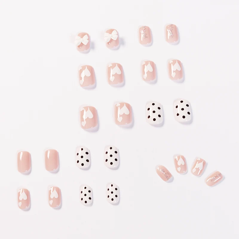 Artful nail art with delicate flower and heart motifs Stornfield