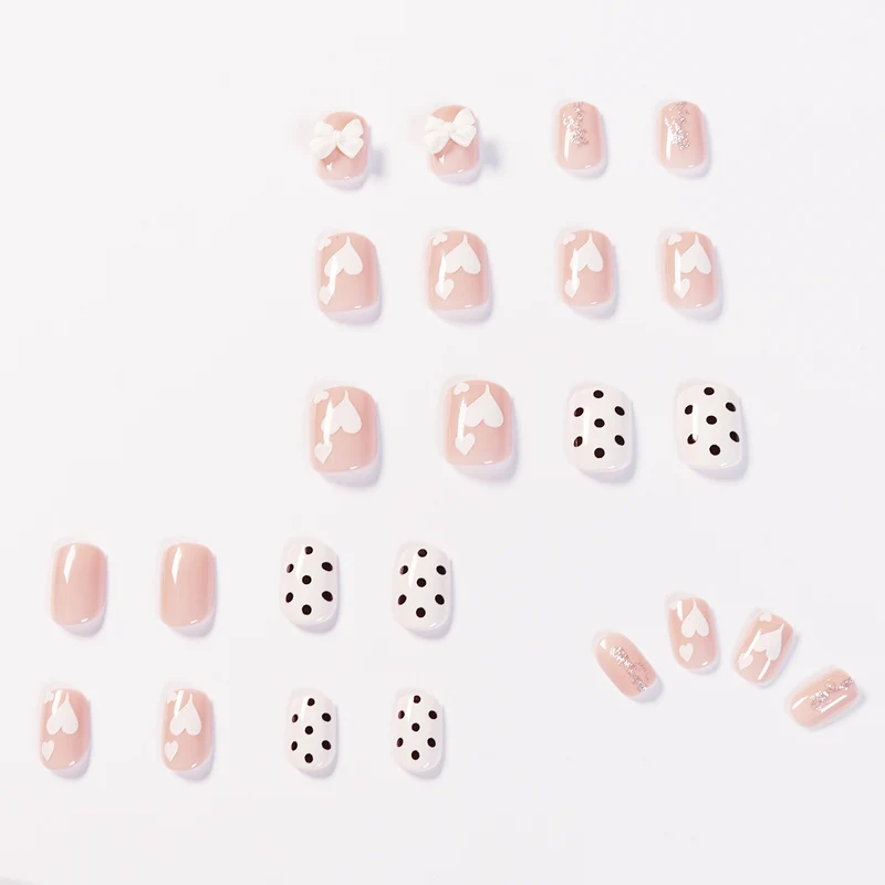 Artful nail art with delicate flower and heart motifs Stornfield