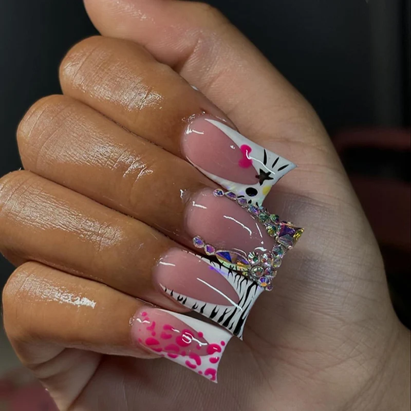 Artistic Nail Art with Animal Motif and Rhinestone Decorations Stornfield
