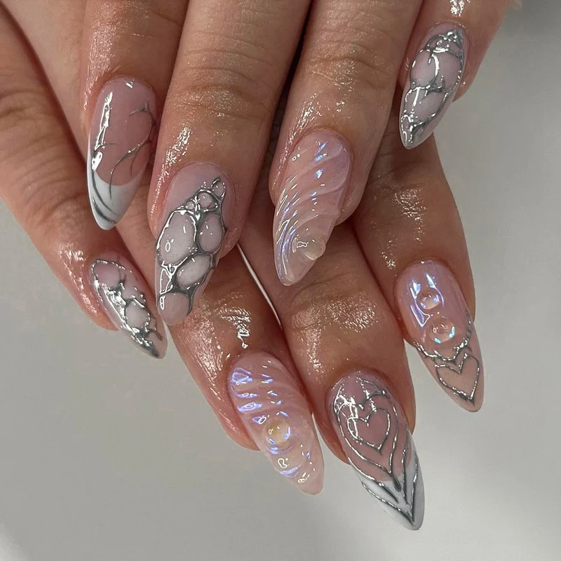 Elegant Stiletto Nail Extensions with Decorative Silver Accents Stornfield