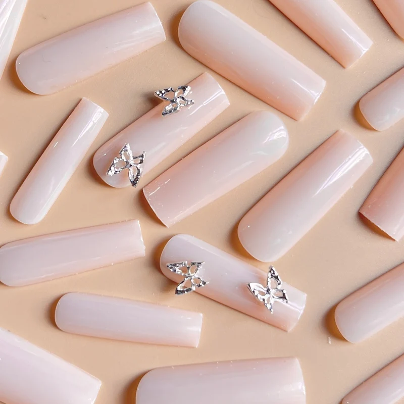 Elegant Long Coffin Nail Extensions with Butterfly Accents Stornfield