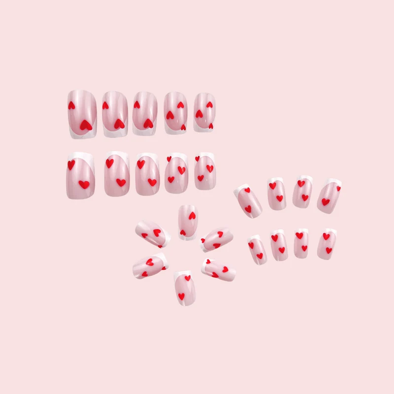 Heart-Embellished French Tip Nail Art Stornfield