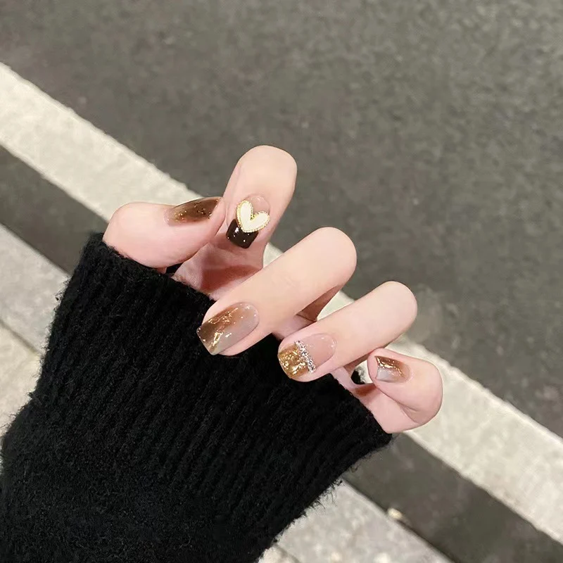 Artistic Nail Extensions with Heart and Glitter Accents Stornfield