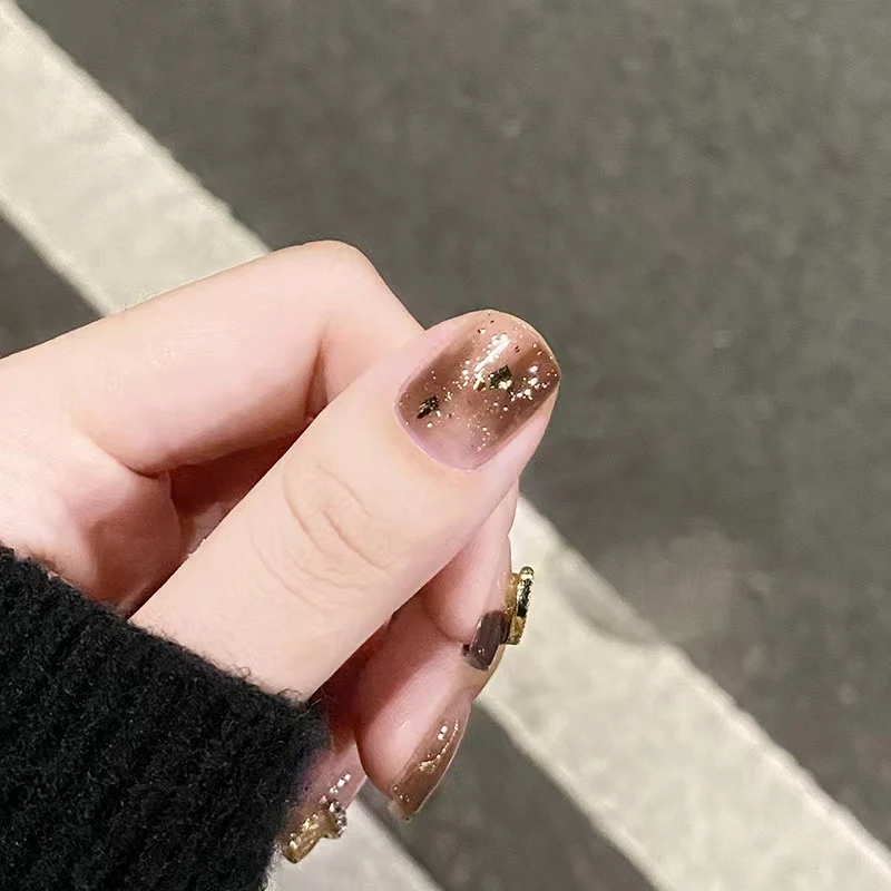 Artistic Nail Extensions with Heart and Glitter Accents Stornfield