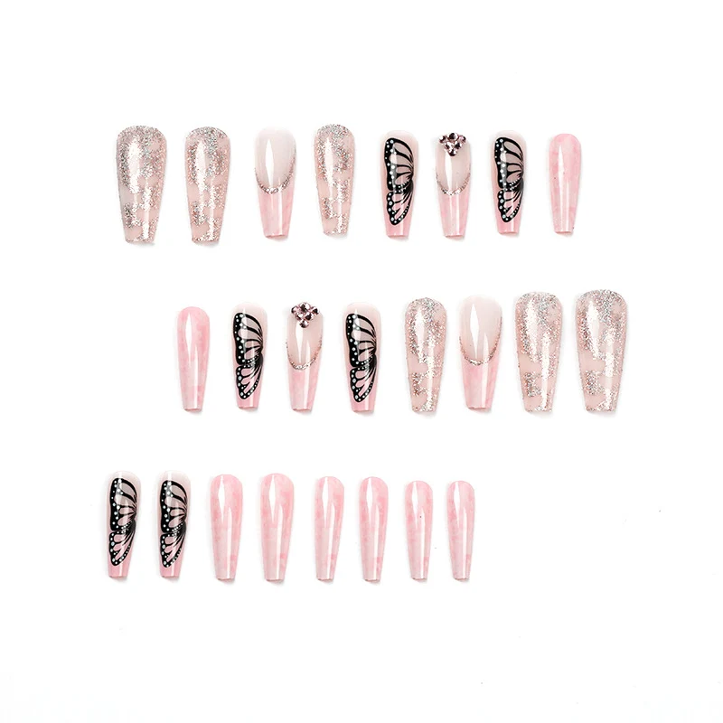 Glamorous nail extensions with beautiful butterfly motifs and glitter accents Stornfield