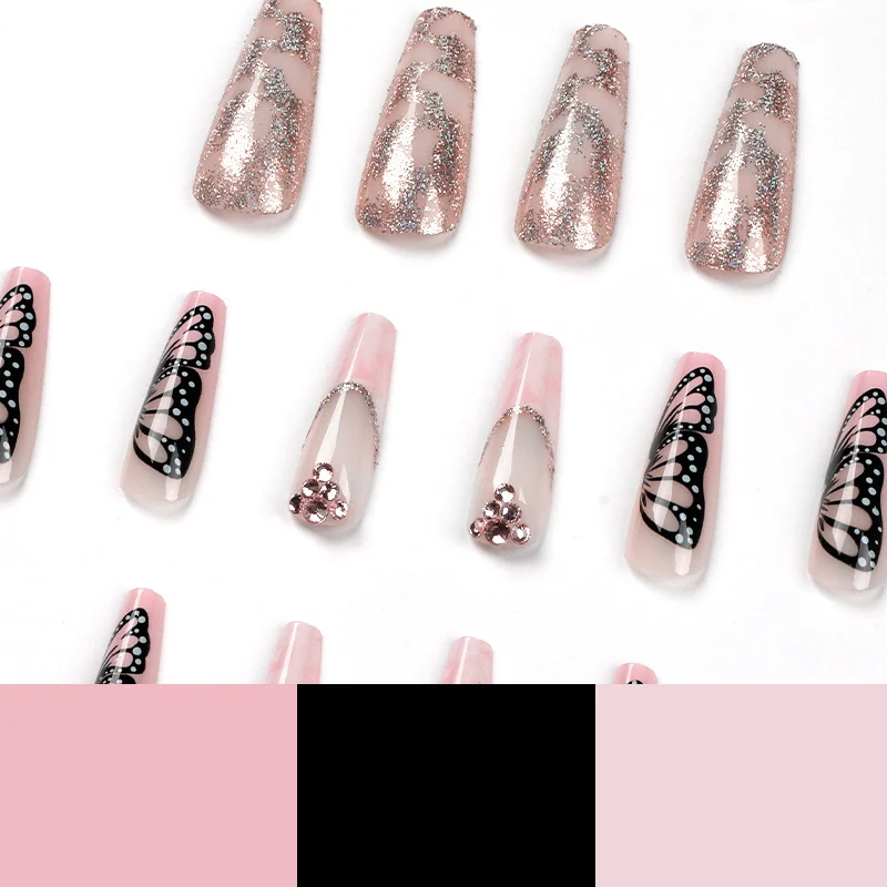 Glamorous nail extensions with beautiful butterfly motifs and glitter accents Stornfield