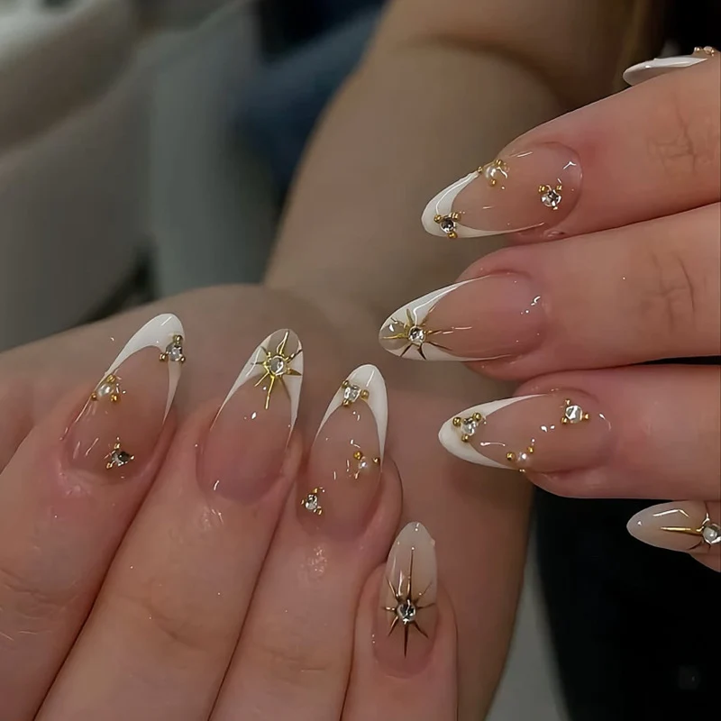 Glamorous nail art with rhinestones and gold accents Stornfield