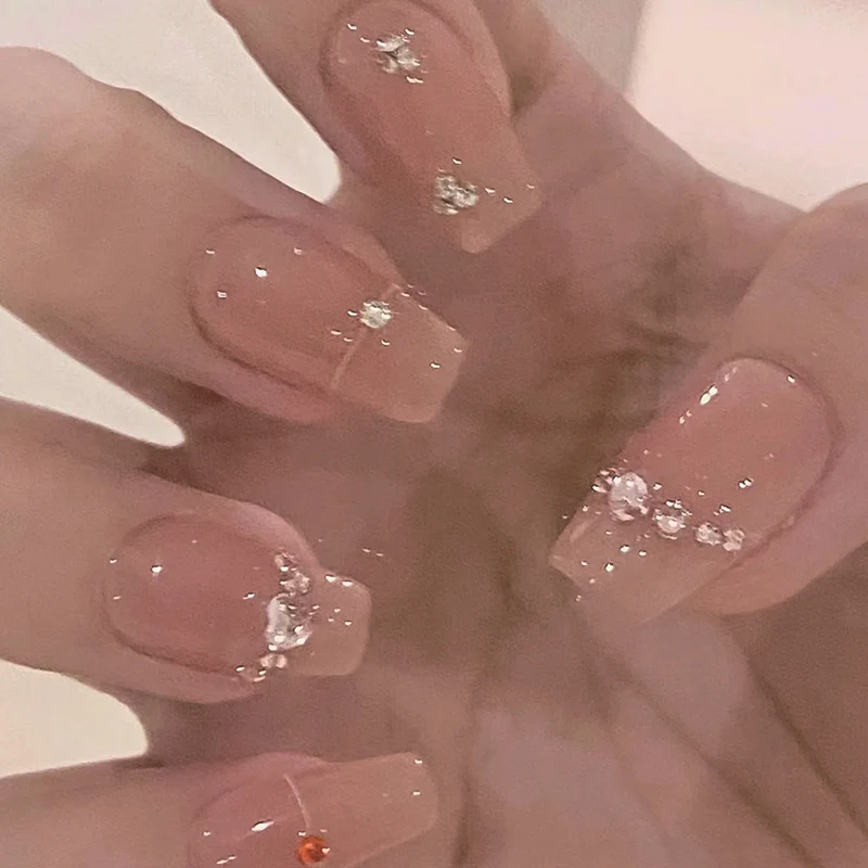 Glamorous nail art with rhinestone embellishment Stornfield