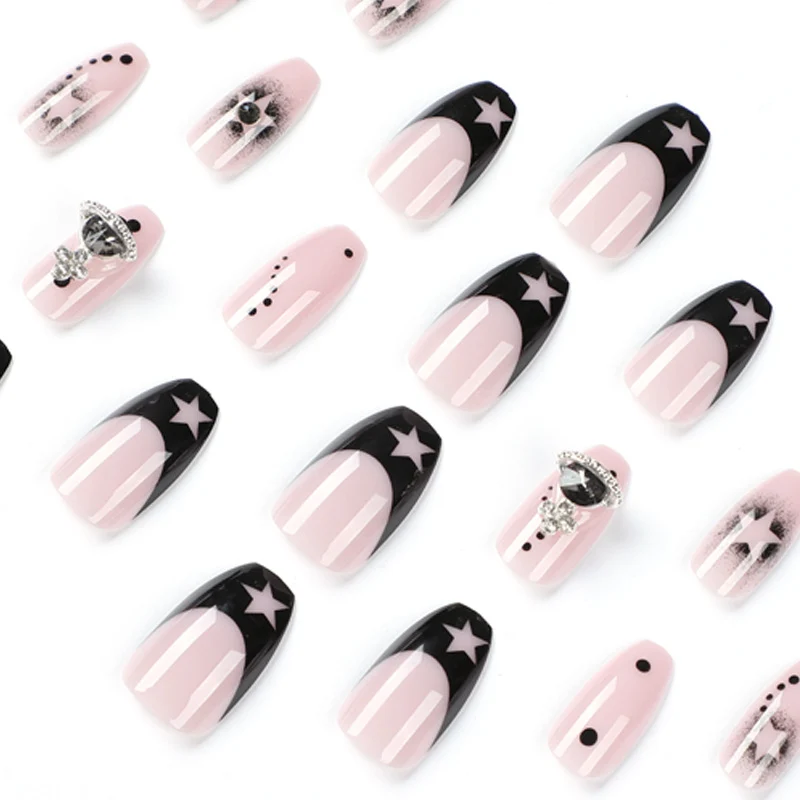 Glamorous nail art with star motifs and glitter accents Stornfield