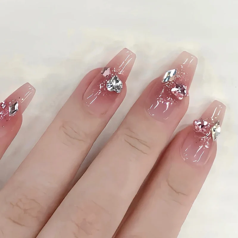 Glamorous artificial nails with glitter and crystal embellishment Stornfield
