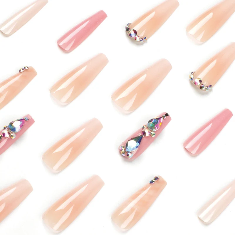 Glamorous artificial nails with gemstone embellishments Stornfield
