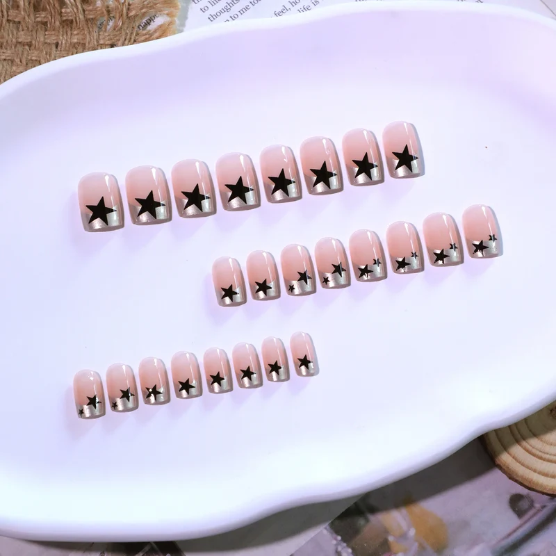 Sparkling nail art with stars and glitter accents Stornfield