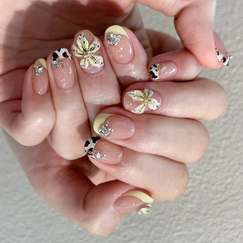 Exclusive nail art with floral design and glitter accents Stornfield