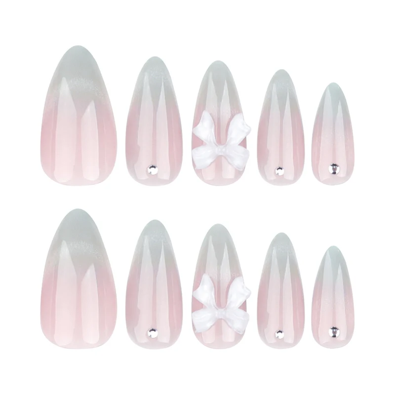 Elegant Stiletto Nails with Glitter and Bow Accents Stornfield