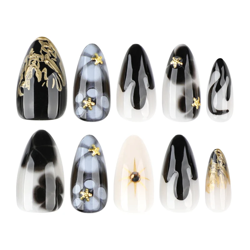 Elegant Stiletto Artificial Nails with Gold Accents and Modern Designs Stornfield