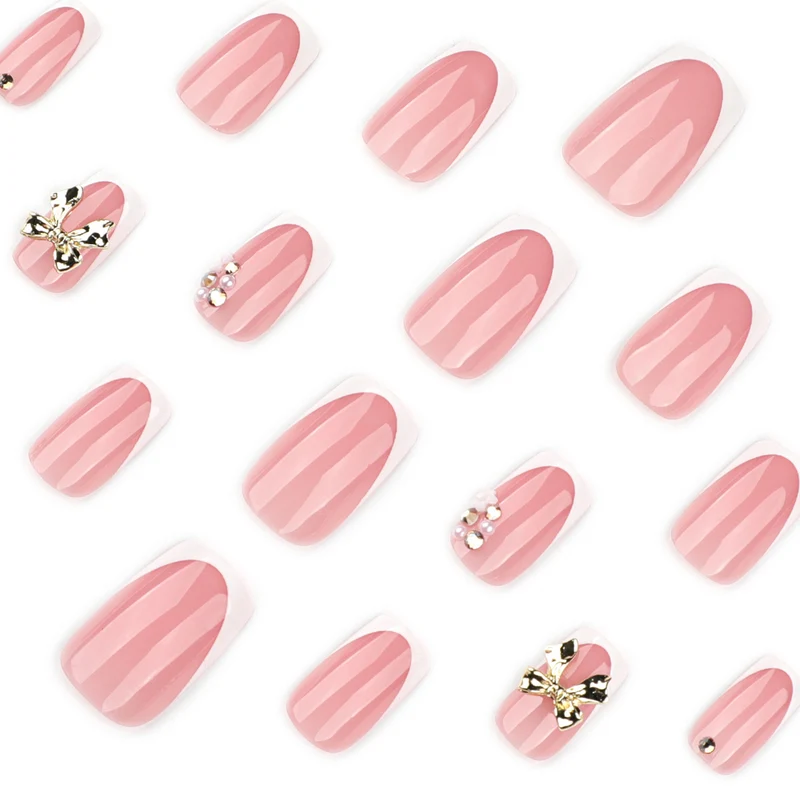 Elegant Nail Extensions with French Tips and Decorative Accents Stornfield