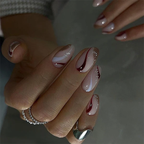 Elegant Nail Art with Modern Wave Pattern and Glitter Accents Stornfield