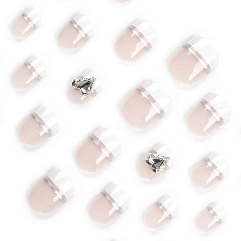 Elegant Nail Art with Glitter Accents and Jewelry Details Stornfield