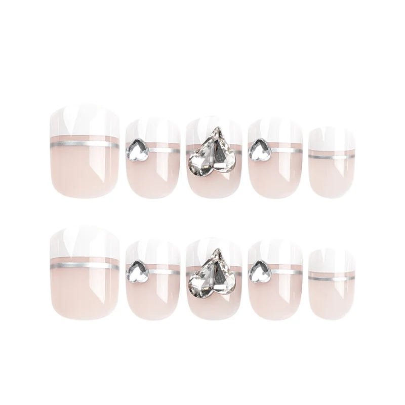 Elegant Nail Art with Glitter Accents and Jewelry Details Stornfield
