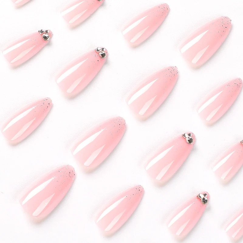 Elegant Nail Art with Glitter and Rhinestone Decorations Stornfield
