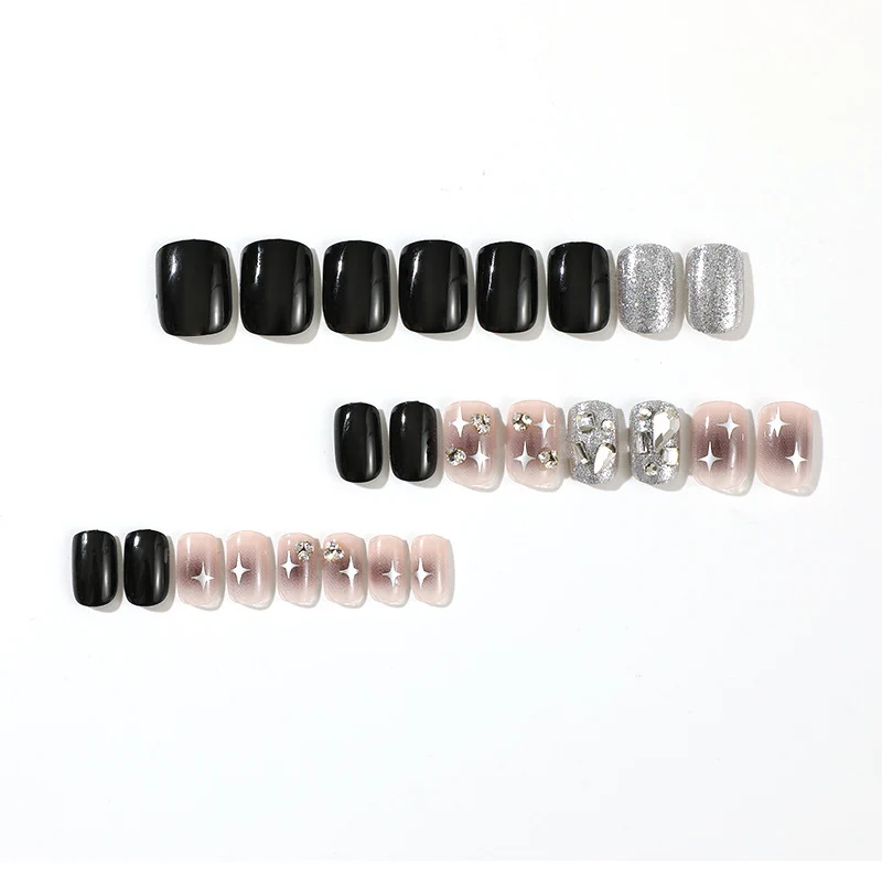 Elegant Nail Art with Glitter and Star Motifs Stornfield